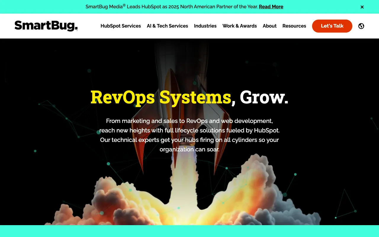 SmartBug Media website hero banner featuring a rocket launch visual with the text 'RevOps Systems, Grow.' and a banner announcing HubSpot Partner of the Year recognition.